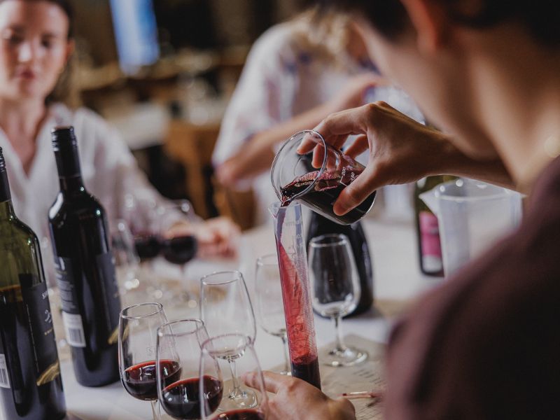group engaged in wine blending