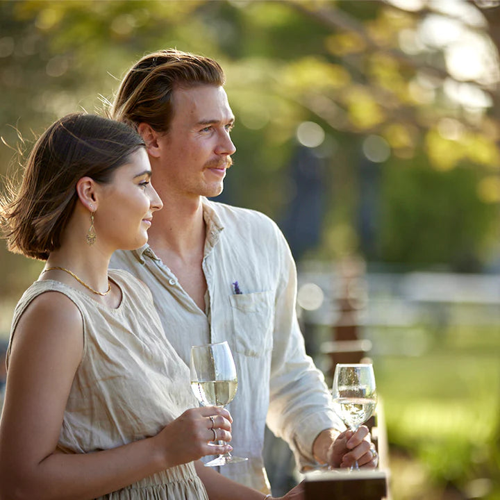 Couple with glass of wine in hand