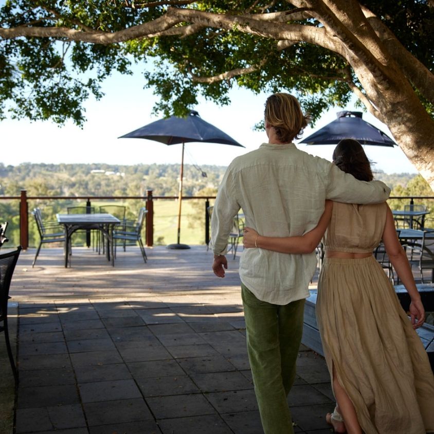 a couple walking around the outdorr terrace of Tuscan terrace dining