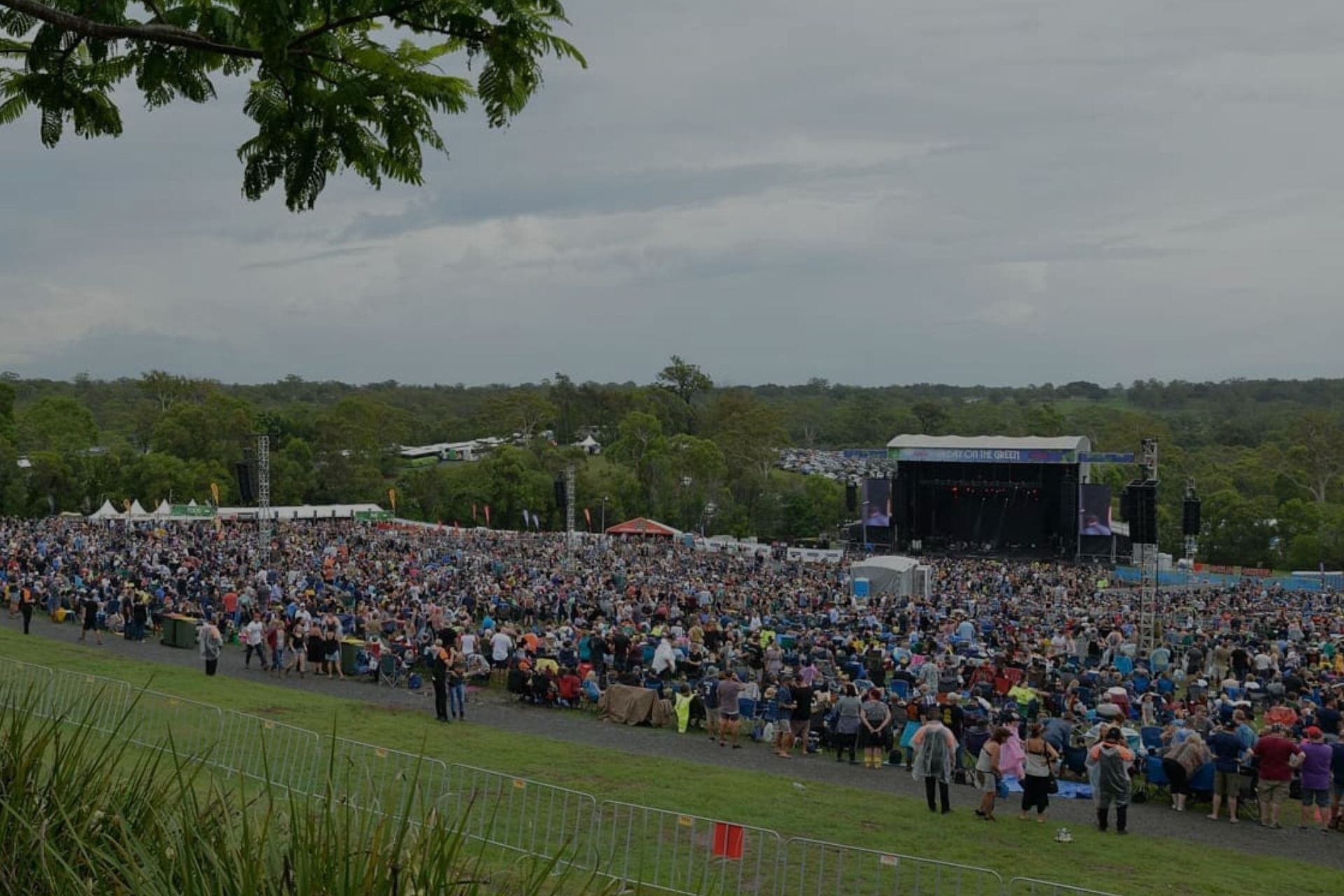 Creowd of people outside watching a music concert